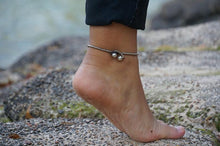 Load image into Gallery viewer, White silver bell boho anklet with small bells and beaded accents, styled as a bohemian accessory from Tan Smokey.