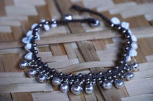 Load image into Gallery viewer, White silver bell boho anklet with small bells and intricate beads, featuring a Tan Smokey brand design on a delicate ankle strap.