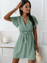Load image into Gallery viewer, Short sleeve V-neck mini dress in green or red by AlmostAnything4You, featuring a stylish fit and vibrant colors.